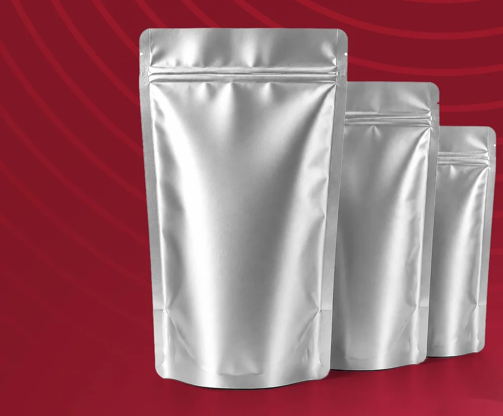 Alüminyum Doypack — Üç katmanlı gümüş alüminyum doypack; yedi farklı ölçüde ve kilitli ağızlı.